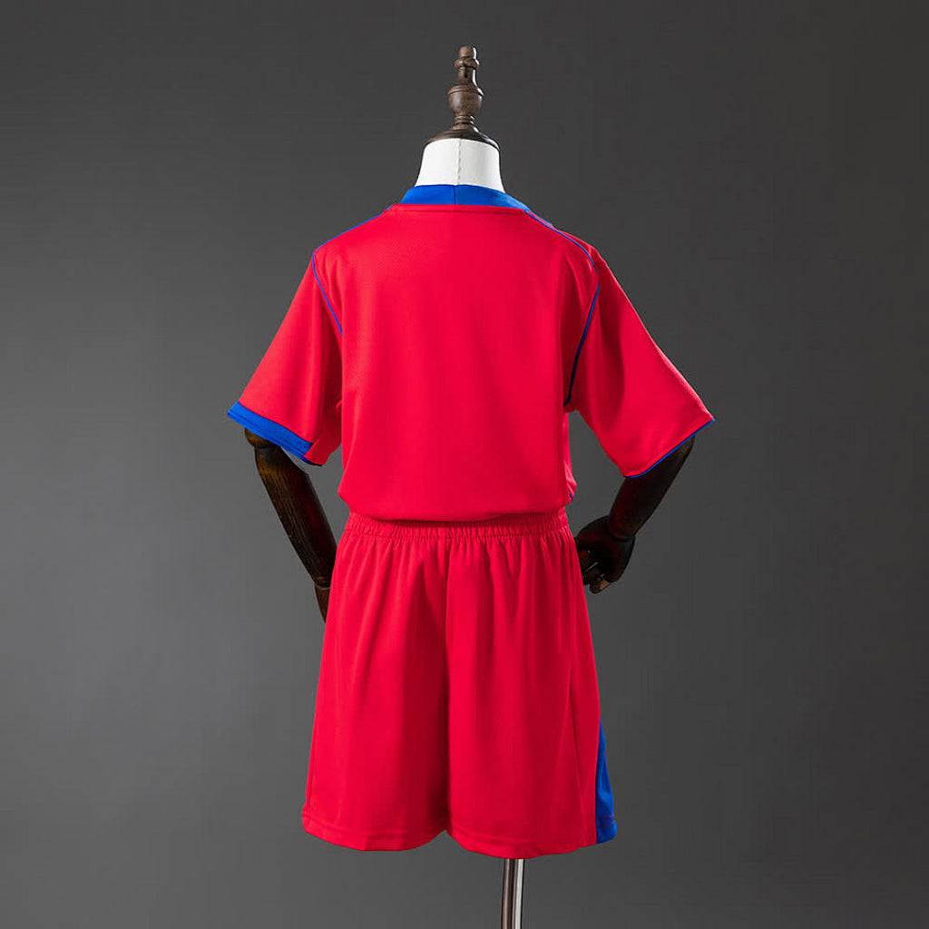 PSG Kids Third Away 25/26 — back view of red Paris Saint-Germain shirt and shorts