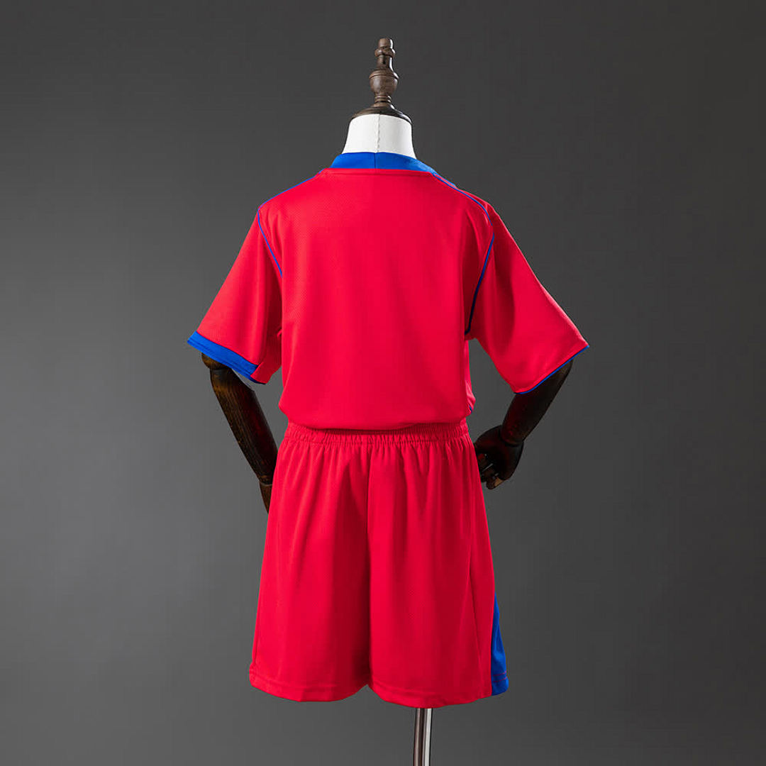 PSG Kids Third Away 25/26 — back view of red Paris Saint-Germain shirt and shorts