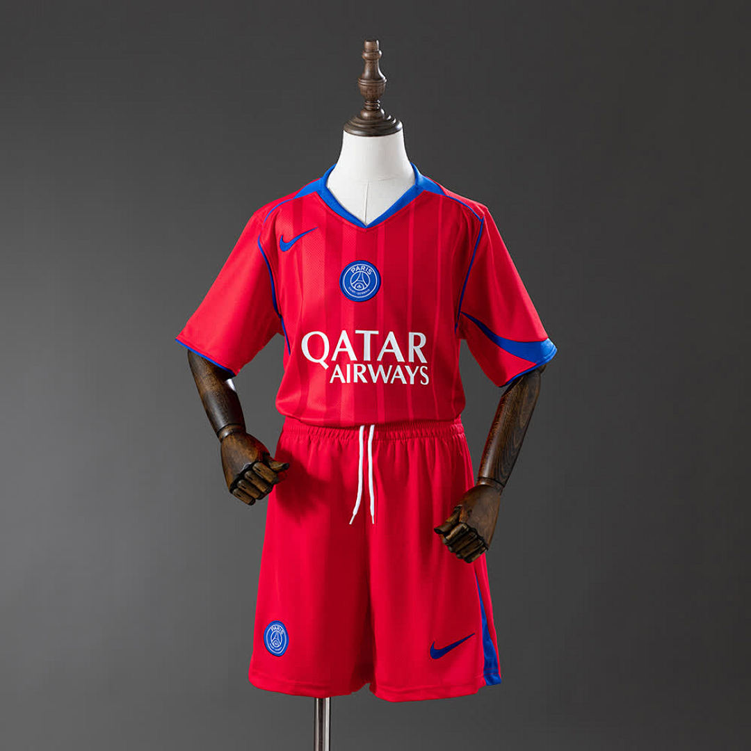 PSG Kids Third Away 25/26 — front view, red shirt with Qatar Airways sponsor and Paris Saint-Germain crest